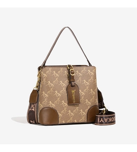 Close-up of brown bucket bag with horse pattern and stylish wide fabric shoulder strap