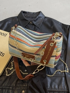 Rainbow woven straw cylinder bag with leather straps and golden flower chain detail
