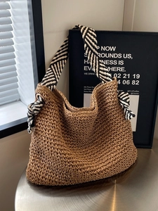 Large capacity straw tote bag with geometric striped straps for summer beach vacations