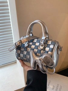 Silver and denim checkered mini cylinder bag with a dog charm and shoulder strap