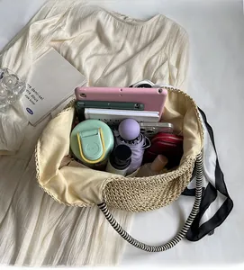 Top view of a large woven tote bag showing spacious interior with daily essentials