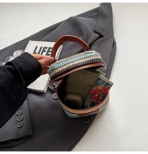 Detail shot of mini multi-color straw bag showing inner capacity for daily essentials