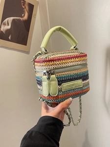 Mini bohemian straw woven crossbody bag with colorful stripes and green leather handle