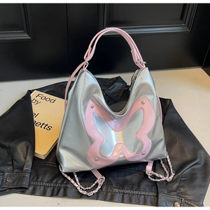 Close-up of silver Hobo bag with pink butterfly embroidery and chain straps