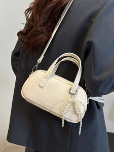 Elegant cream PU leather crossbody bag for women with pearl bow charm and adjustable strap
