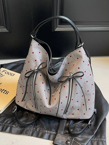 Chic grey tote bag with red polka dots, black leather bow and dual zip pockets