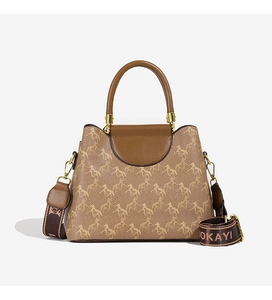 Close-up of brown bucket bag with horse print, gold hardware, and wide logo strap
