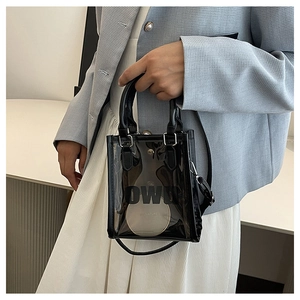 Detail of black transparent PVC mini square bag with DWU logo and shoulder strap