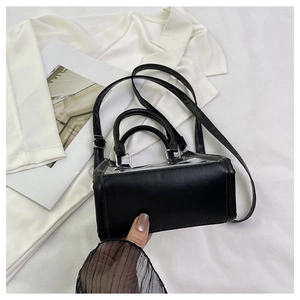 Close-up of a black jelly beach bag featuring a sleek PVC and PU leather combination