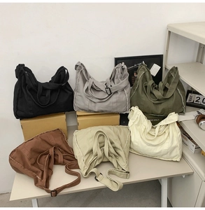Group display of canvas tote bags in six colors with stylish fringe edge details