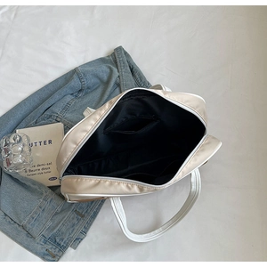 Detail view of large tote bag interior with zipper pocket and multiple compartments
