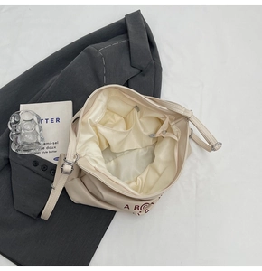 Top view of spacious interior with light beige lining and pocket on tote backpack