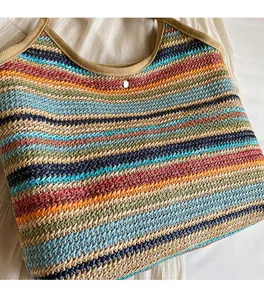Detailed macro view of colorful woven straw bag texture with silver magnetic buckle