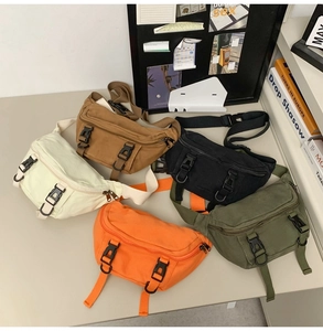 Detail of five stylish canvas crossbody bags with durable dual-buckle closure designs