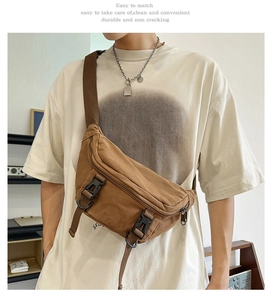 Macro detail of the durable brown canvas chest bag showing the textured material and straps