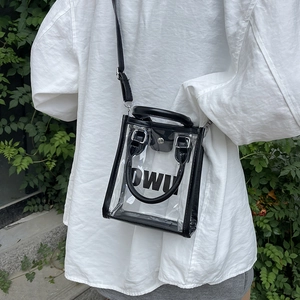 Minimalist transparent PVC crossbody bag with black trim and DWU print for beach holidays