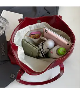 Top-down view of spacious red tote bag interior showing ample storage and compartments