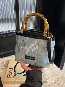 Mini sequined bucket bag with bamboo handle and adjustable leather crossbody strap