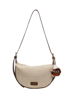 Chic beige woven half-moon crossbody bag with brown leather trim and a cute plush charm