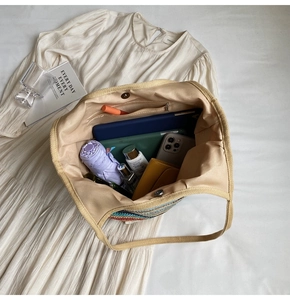 Detailed top view of a colorful woven tote bag showing its large interior storage capacity