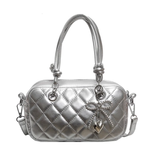 Chic silver quilted crossbody bag with heart pendant and knotted top handle for women