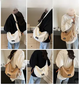 Vues détaillées du sac bandoulière en toile avec bandoulières et détails de fermeture