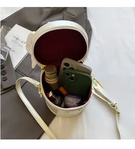 Top view of white leather bucket bag interior showing spacious storage for essentials