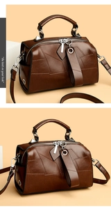 Detailaufnahme der braunen Boston Bag mit geometrischem Patchwork und silbernen Metallteilen