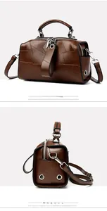 Detailansicht der braunen Boston-Tasche mit Lederstruktur und abnehmbarem Gurt