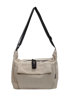 Minimalist beige canvas crossbody bag with adjustable strap and large capacity