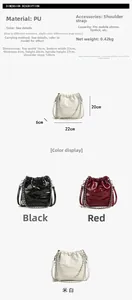 Detail view of quilted bucket bag dimensions with chain strap in black, red and beige