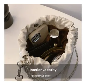 Internal view of a white quilted bucket bag showing ample storage for daily essentials