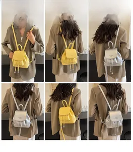 Mini fashion bucket backpack in yellow and silver synthetic leather shown on model