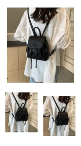 Detail of black mini backpack with silver drawstring beads and pebble leather texture