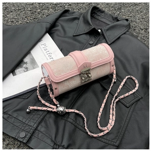 Detail of light pink floral cylinder bag featuring metal chain and M-logo lock