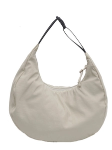 Minimalist beige nylon crescent bag with adjustable black shoulder strap for commuting