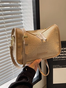 Summer woven crossbody bag in light brown texture with adjustable shoulder strap