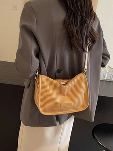 Chic woven straw crossbody bag in mustard yellow with adjustable PU leather shoulder strap