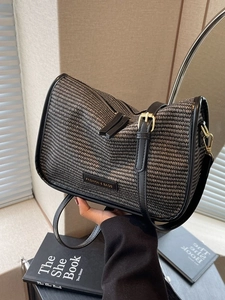 Woven black and white square crossbody bag with adjustable strap and double zipper