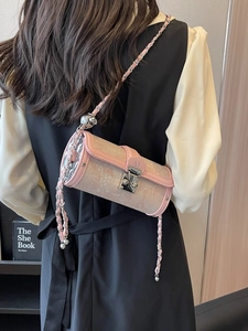 Elegant pink cylindrical crossbody bag with silver chain strap and M logo lock