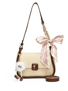 Chic cream white crossbody bag with brown trim, pink silk scarf, and plush charm detail