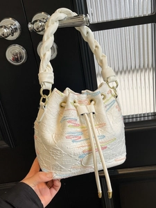 White canvas bucket bag with embossed FF pattern and woven handle for summer fashion
