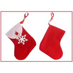 Red and white Christmas stockings set with snowflake charms and hanging loops