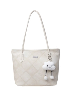 Quilted cream tote bag with elegant diamond stitching and plush cloud charm accessory