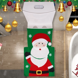 Detail showing Santa Claus motif on green plush Christmas toilet seat cover and floor mat