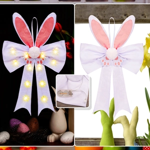 Detail showing lighted LED rabbit ear bow with battery box for Easter door decor
