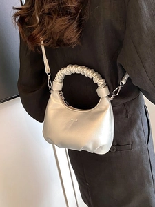 Silver metallic dumpling bag with scrunchie handle for women’s fashion 2026