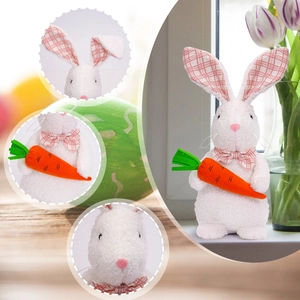 Close-up detail of white plush Easter bunny with carrot and pink plaid bowtie decoration