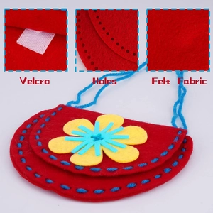 DIY sewing kit for kids featuring a red felt sun flower bag with pre-punched holes