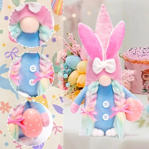 Detail view of Easter gnome plush with bunny ears, blue outfit and spotted egg